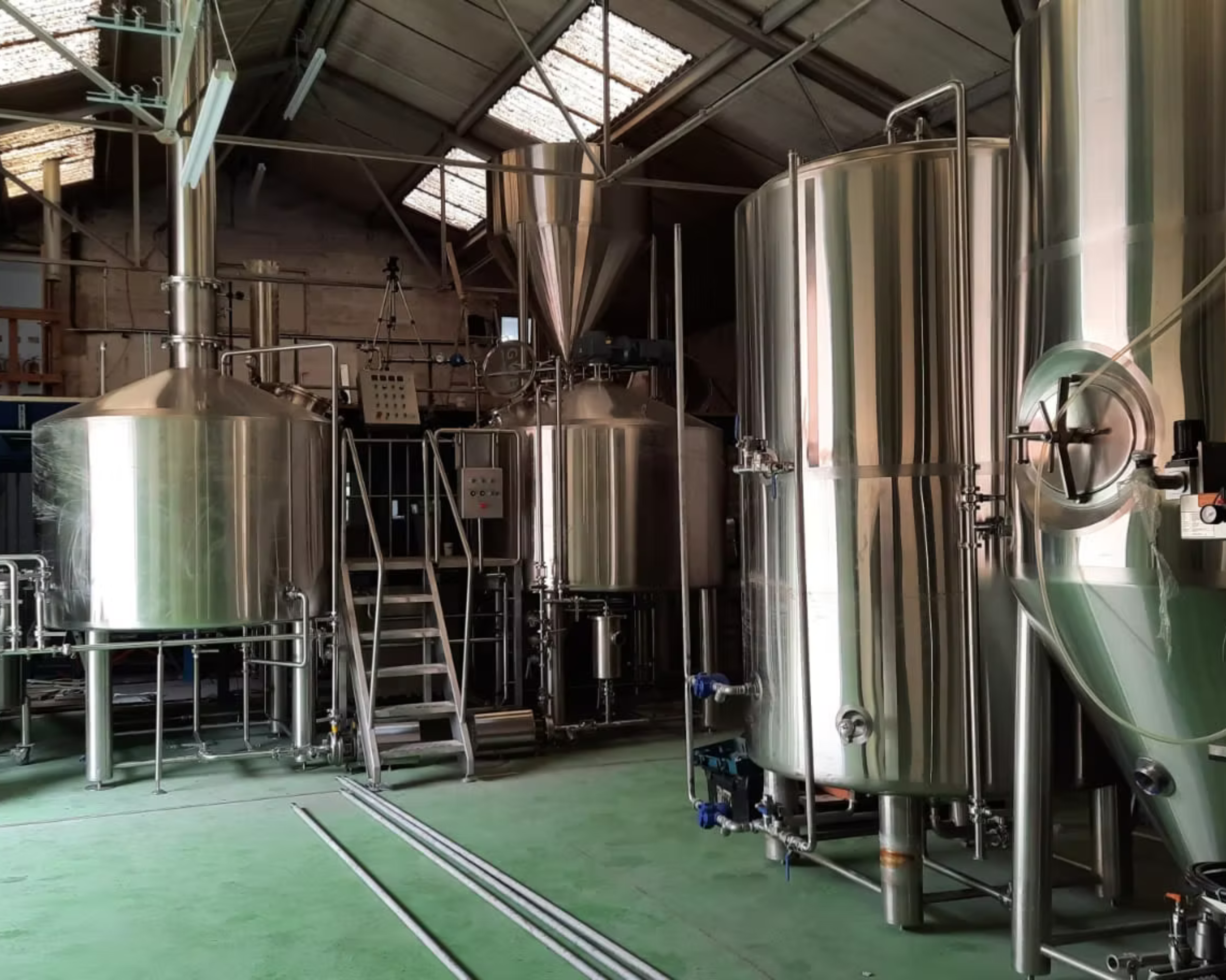 A photo from the inside of Hop Union Brewery showing the brew kit and fermenters after they were first installed